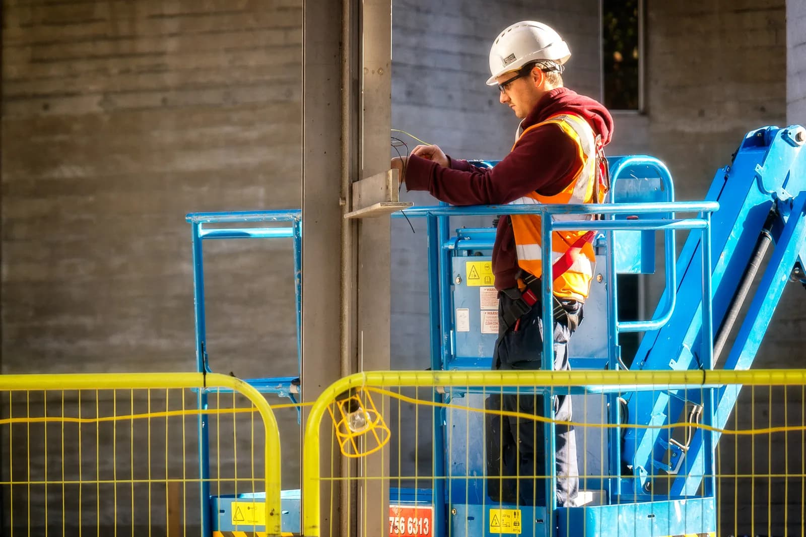 Electrician working on wiring at a job site