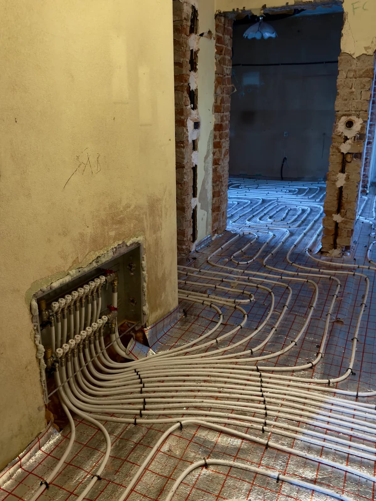 Underfloor heating being installed during a residential renovation